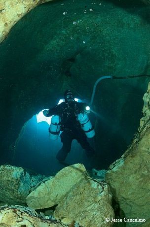 Don Dibble, who is an owner of a dive shop tried to discover the virgin cave areas himself to save future divers from risking themselves into the well